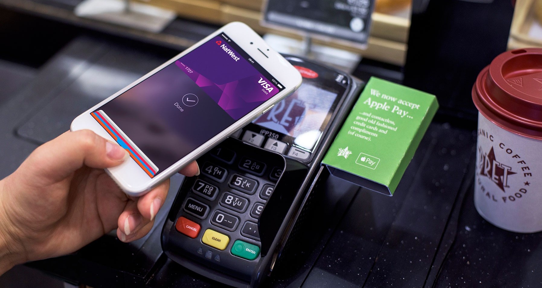 A customer paying with Apple Pay at a Pret A Manger branch