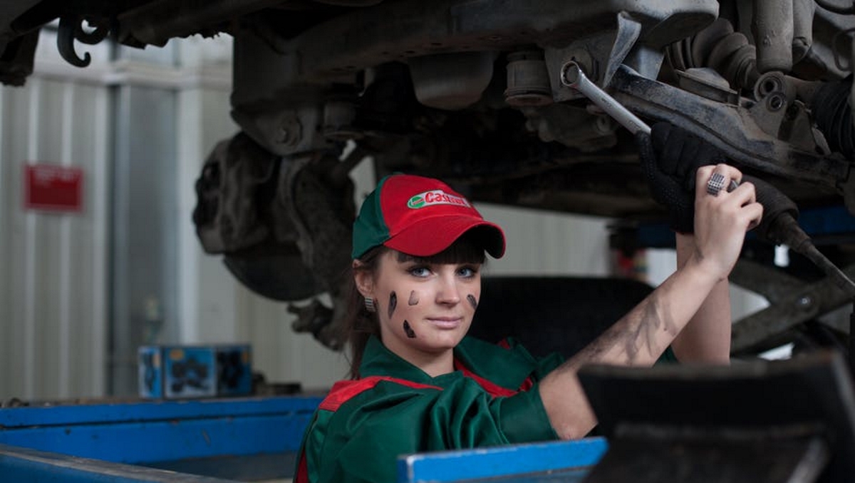 Woman fixing car