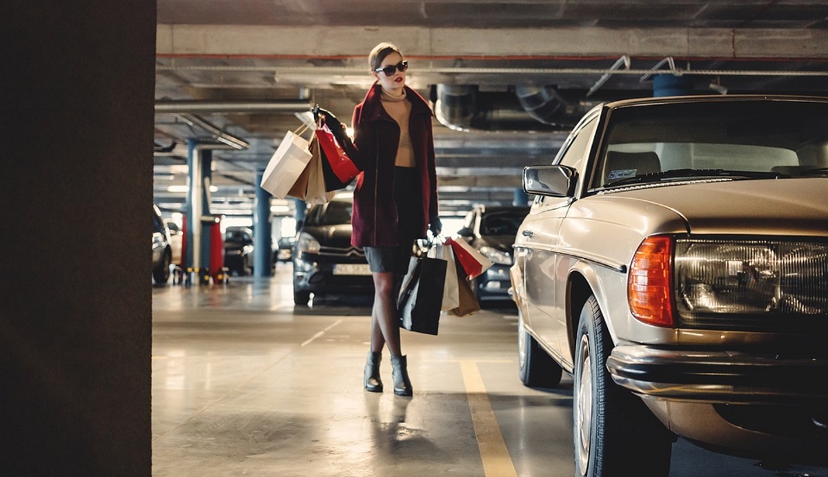 Woman shopping car park